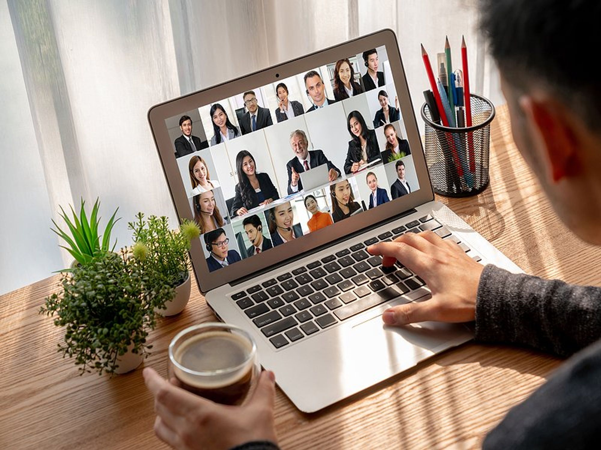 Man attends a remote workshop on his laptop