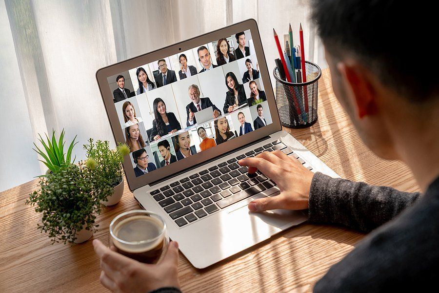 Man attends a remote workshop on his laptop