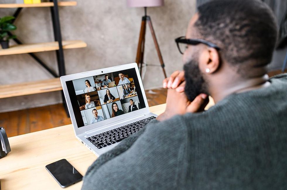 Man attends an online networking event