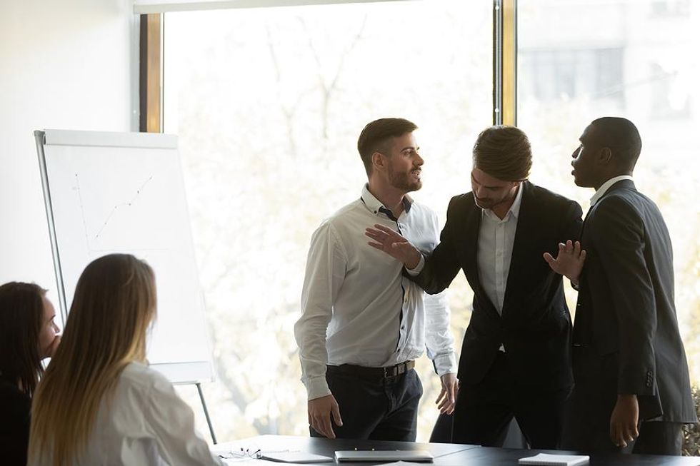 Man breaks up a fight between his coworkers