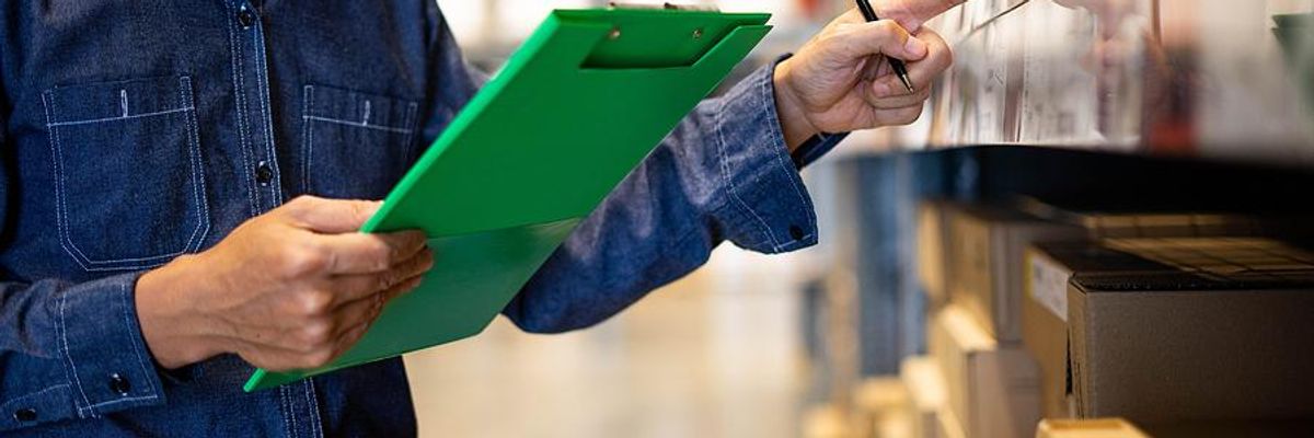 Man checks products in a warehouse