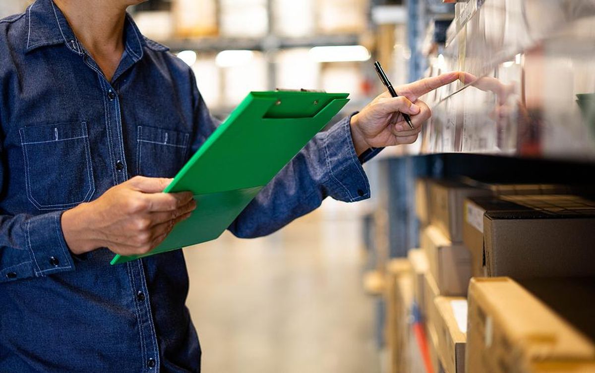 Man checks products in a warehouse