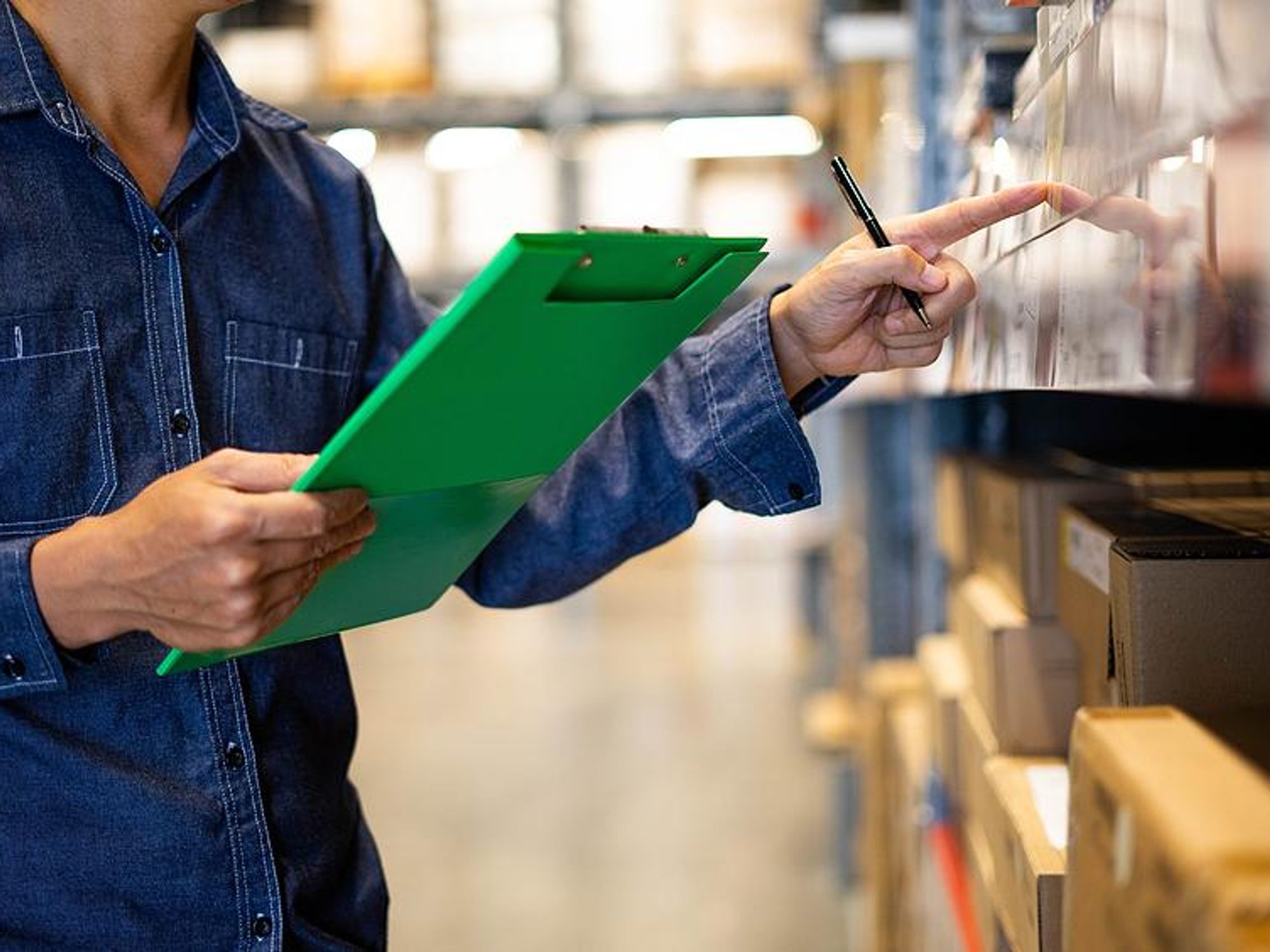 Man checks products in a warehouse