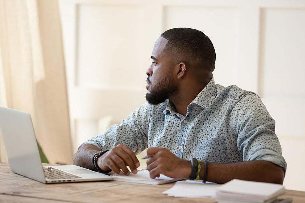 Man dreading work tries to work through his lack of motivation