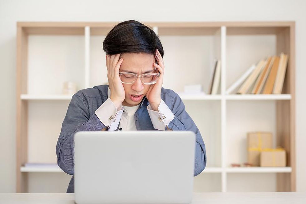 Man experiencing job burnout