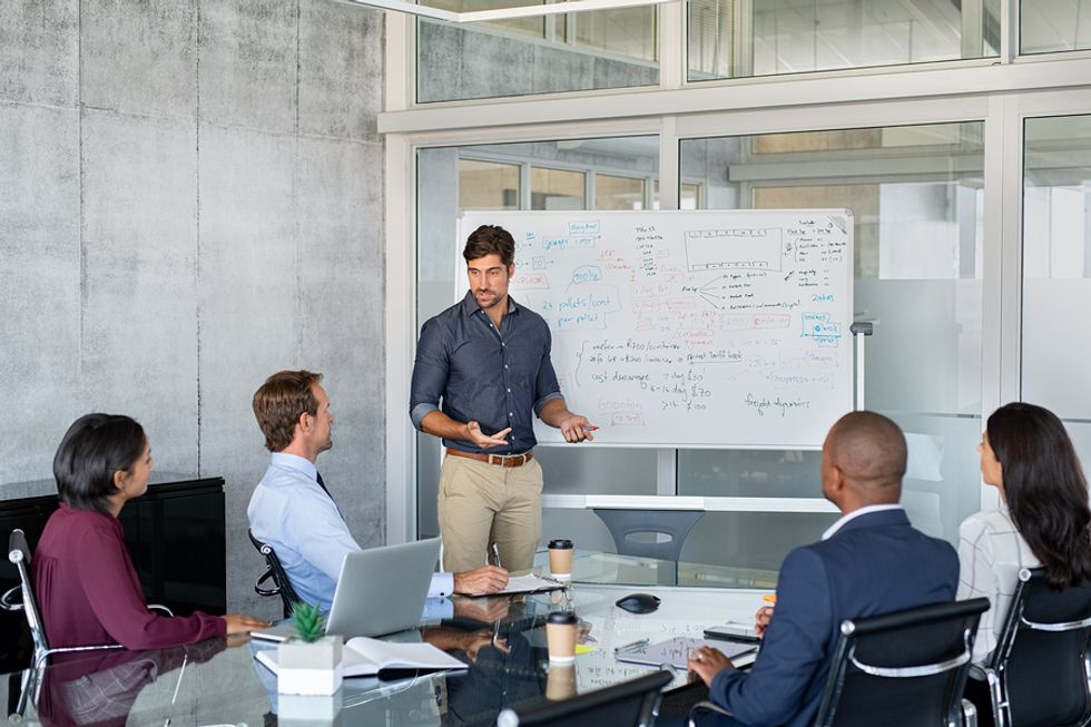 Man gives a presentation at work during a meeting