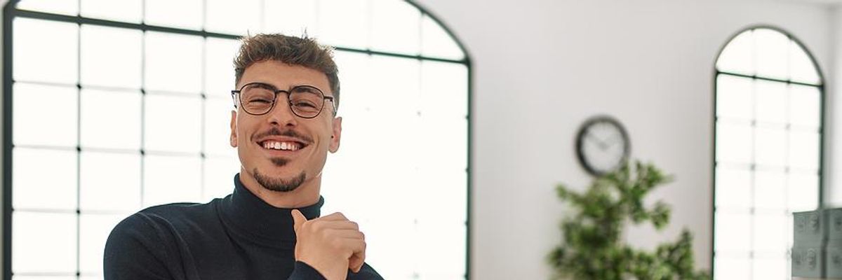 Man happy at work after getting a promotion