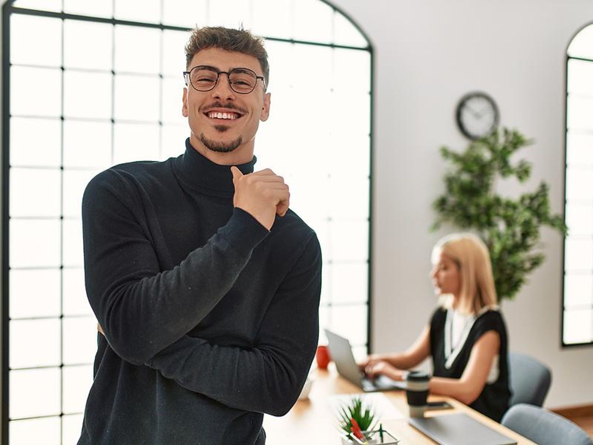 Man happy at work after getting a promotion