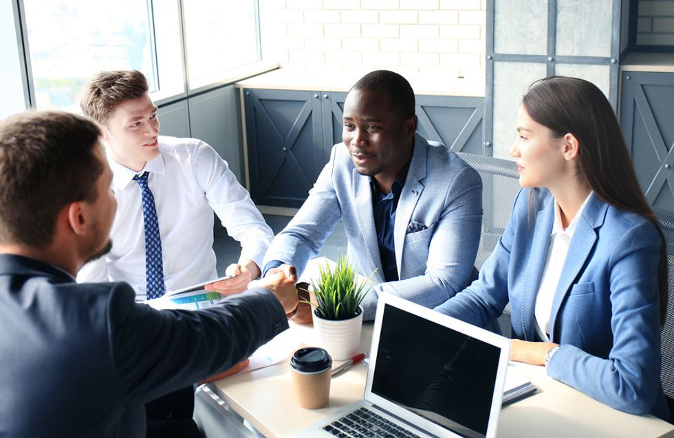 Man introduces himself during a group interview