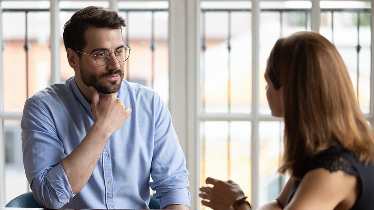 Man listens to hiring manager during a job interview
