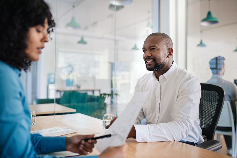 Man listens to the hiring manager during a job interview