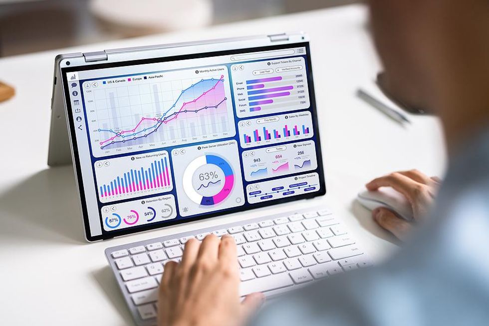 Man looks at graphs and data