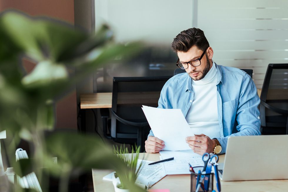 Man looks at his 30-60-90 day plan for a job interview