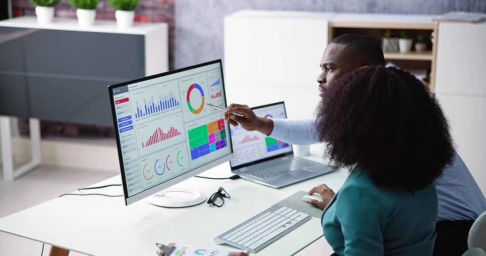 Man looking at KPI with his colleagues