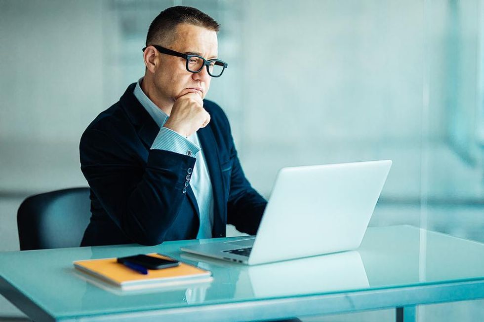 Man looks at the work experience on his resume