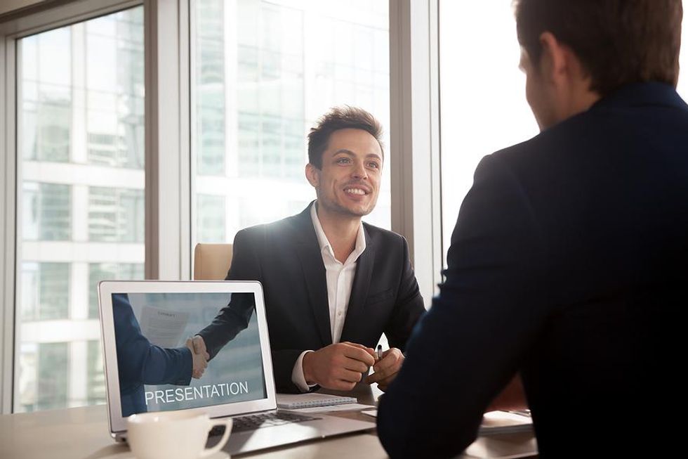 Man makes a sales presentation at work