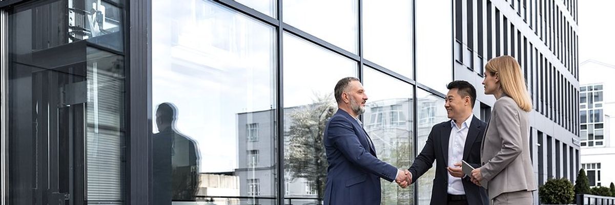 Man meets with business partners/clients/customers