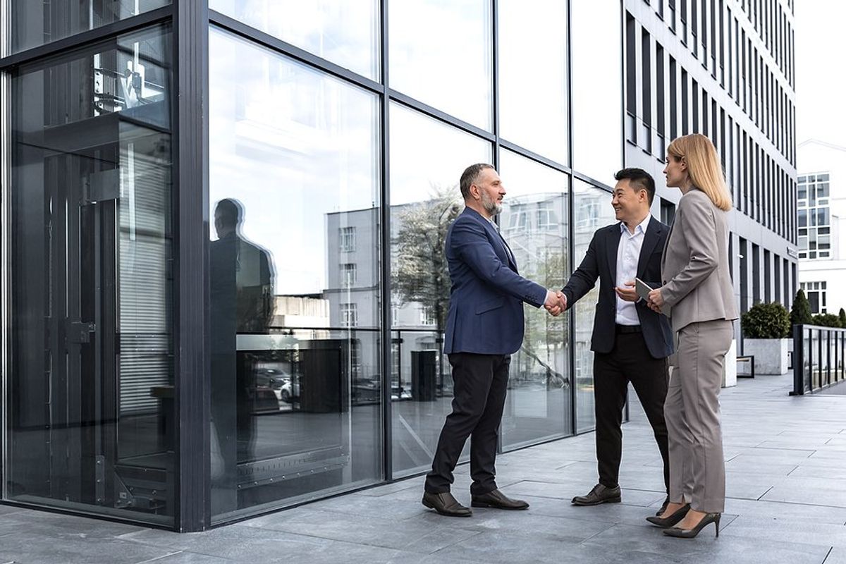 Man meets with business partners/clients/customers