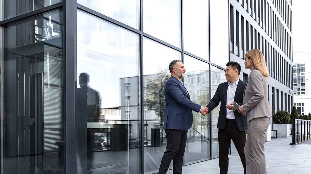 Man meets with business partners/clients/customers