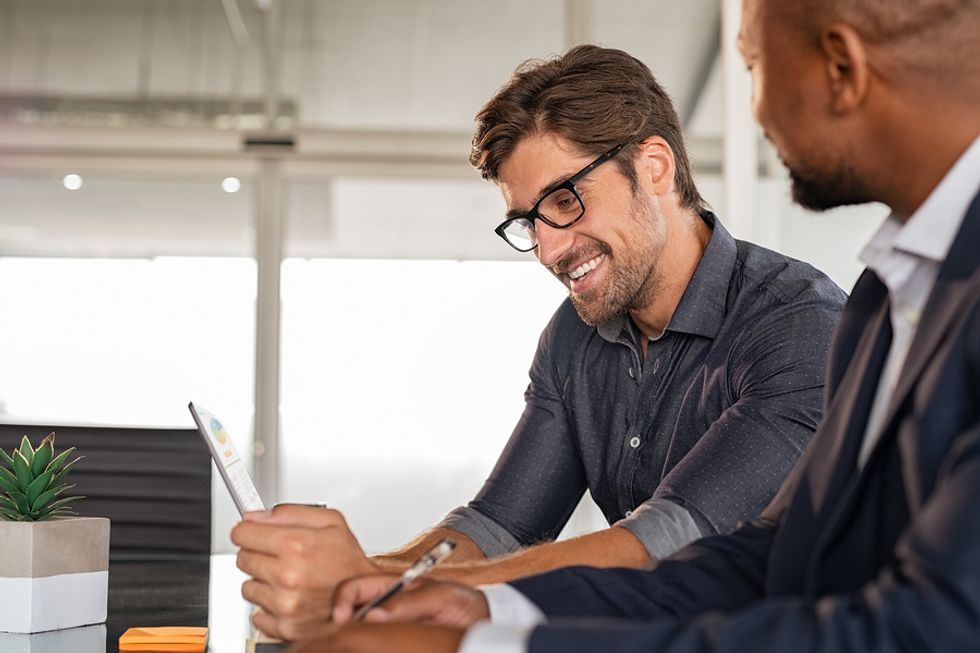 Man meets with his new boss at work