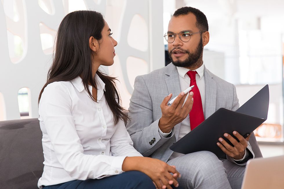 Man mentors a woman to help her improve her career