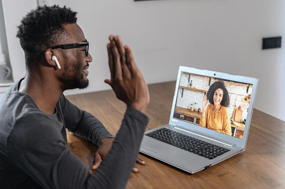 Man on a video call with someone in his network