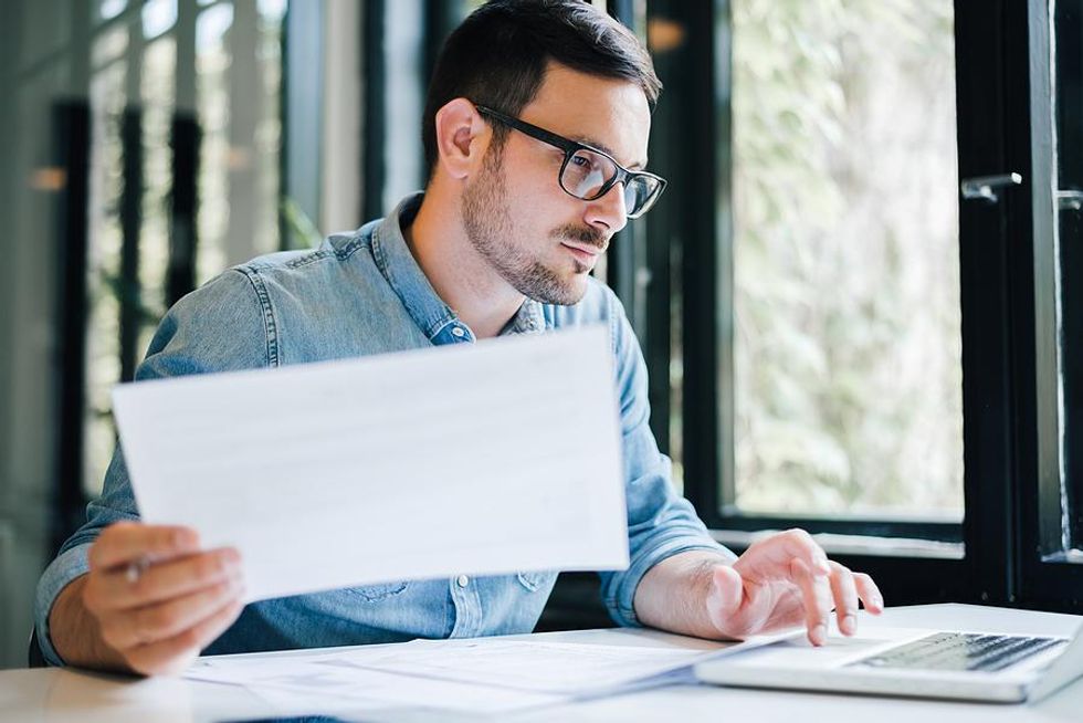 Man on laptop attends a remote workshop