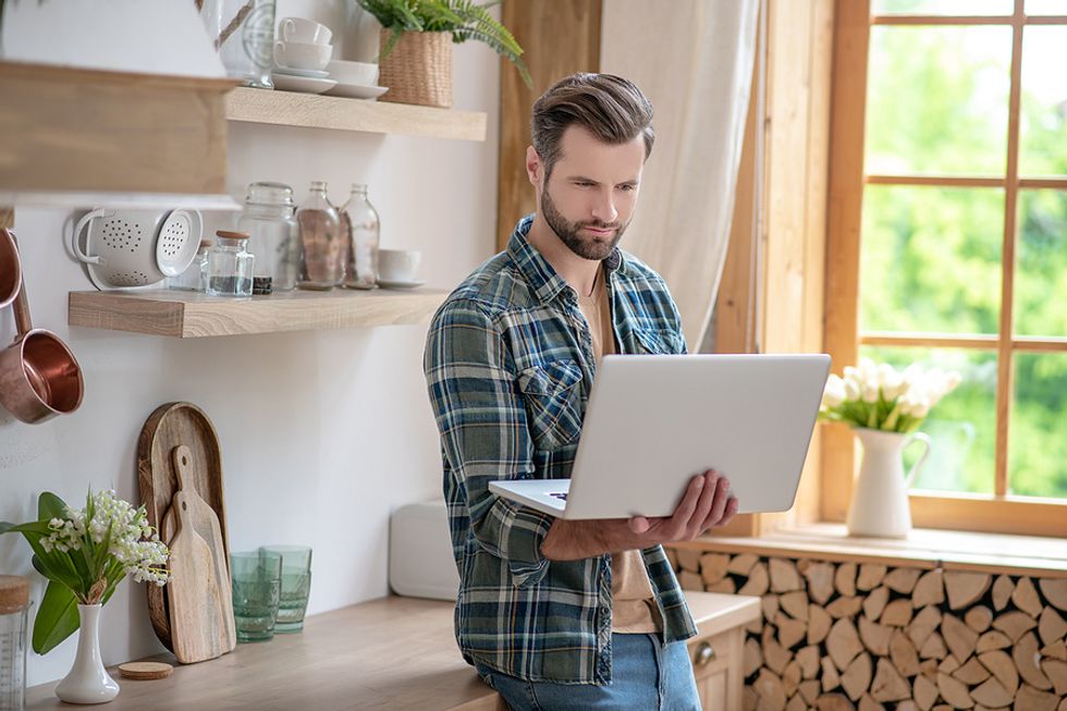 Man on laptop deletes "To Whom It May Concern" on his cover letter