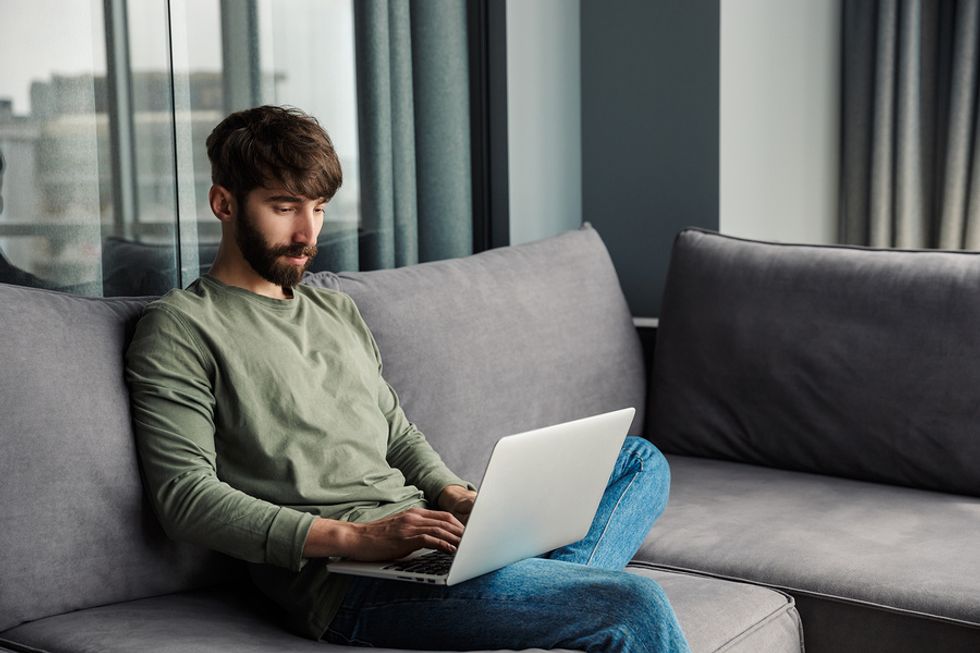 Man on laptop fixes his cover letter mistakes