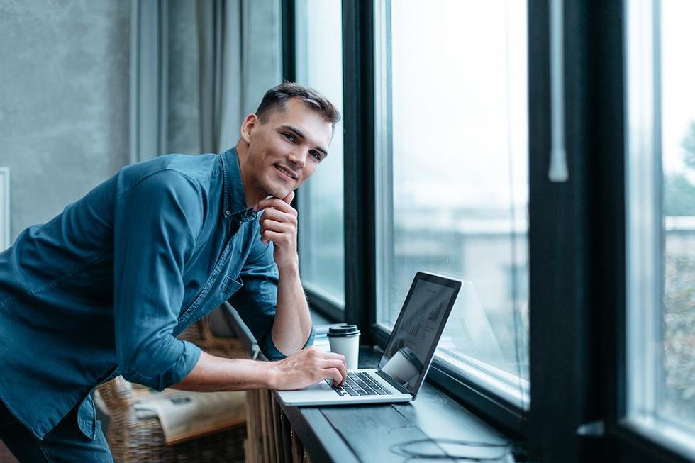 Man on laptop follows the best resume tips