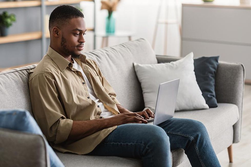 Man on laptop introduces two people in his network