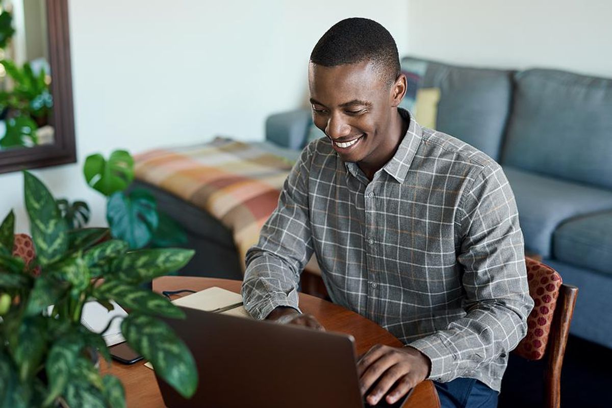 Man on laptop logs in to his LinkedIn account