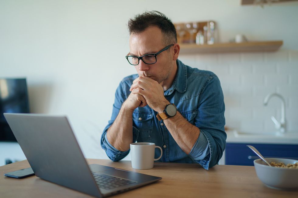 Man on laptop persists after failing