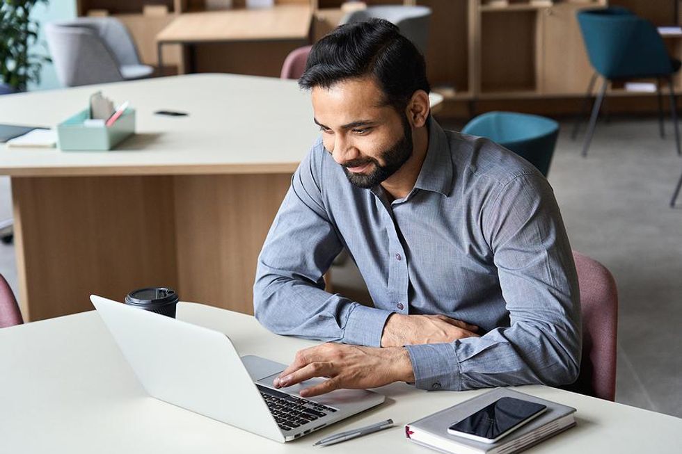 Man on laptop plans his next training session