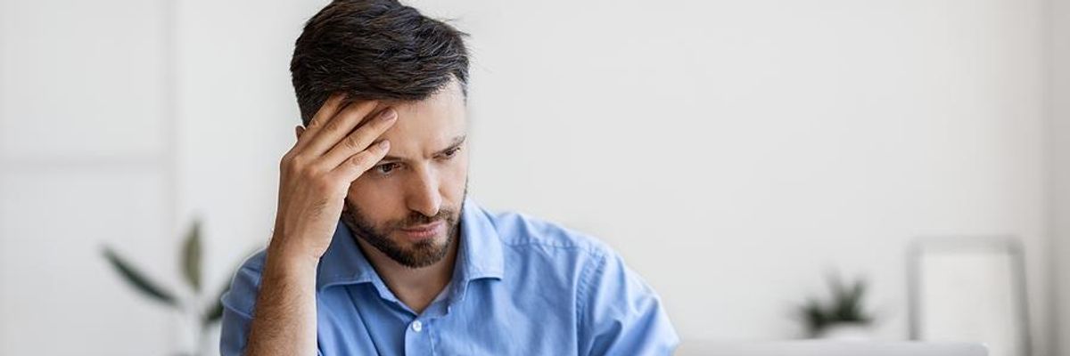 Man on laptop realizes he got ghosted by a LinkedIn connection