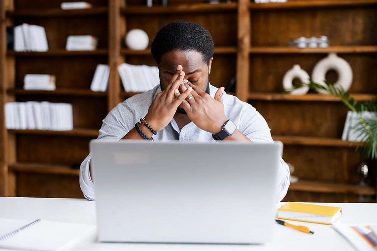 Man on laptop realizes his resume isn't working