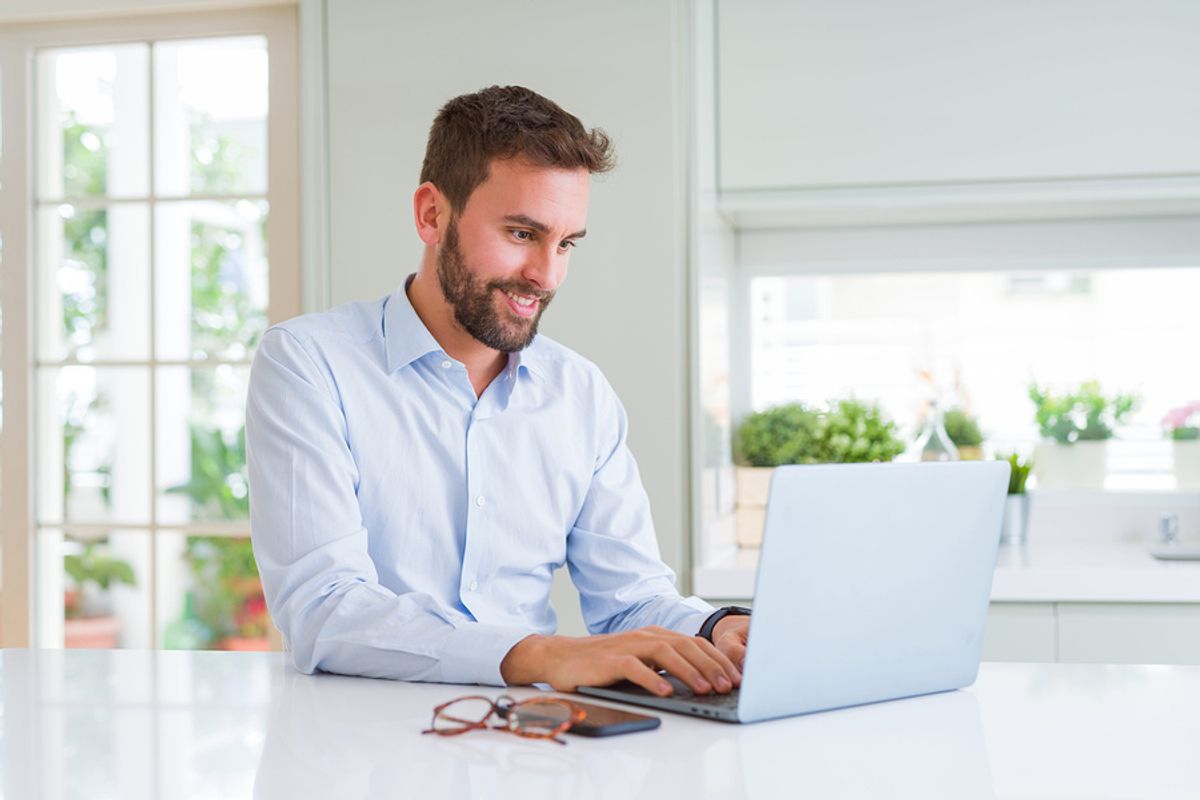 Man on laptop starting a conversation on LinkedIn with his new connection