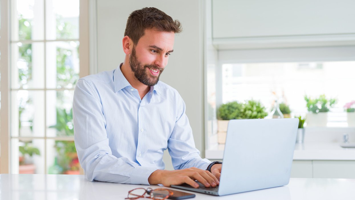 Man on laptop starting a conversation on LinkedIn with his new connection