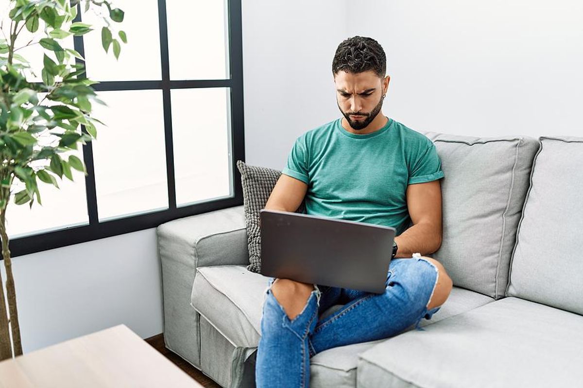 Man on laptop successfully avoids a job search scam