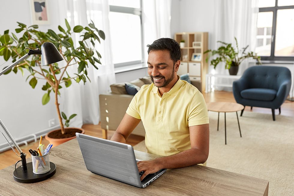 Man on laptop tries to improve his career