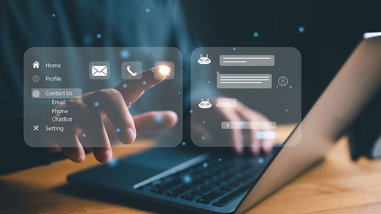 Man on laptop uses AI at work