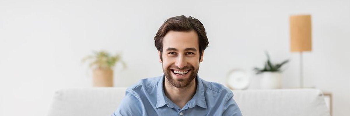 Man on laptop with a flexible work schedule works from home