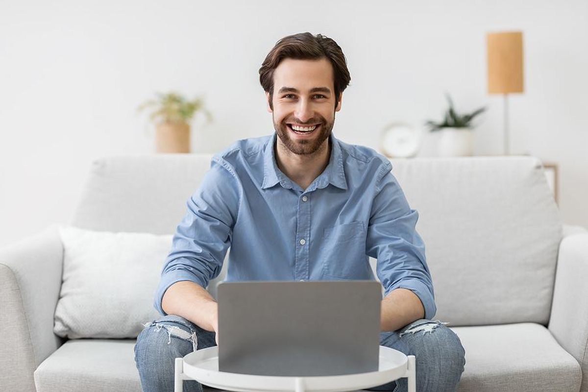 Man on laptop with a flexible work schedule works from home