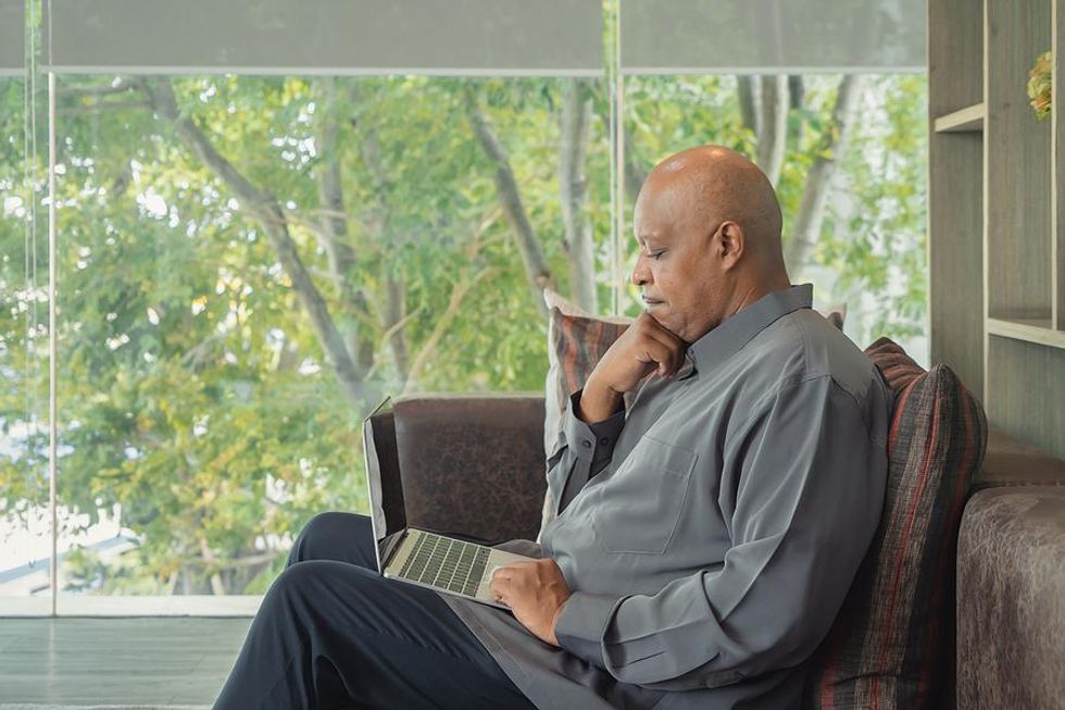 Man on laptop worried he got ghosted by a LinkedIn connection