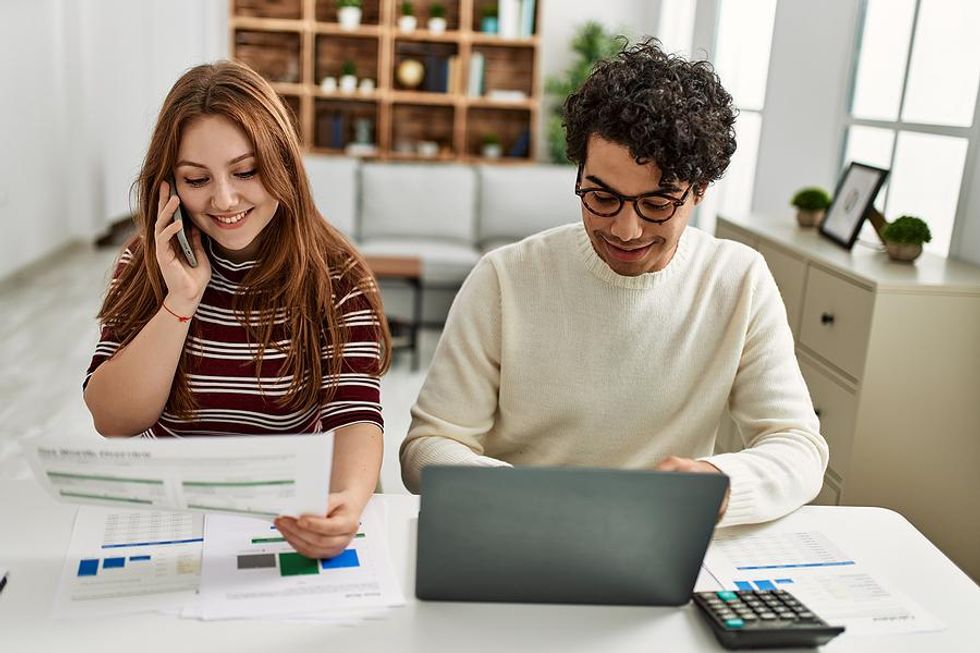 Man on laptop writes a LinkedIn recommendation for his coworker