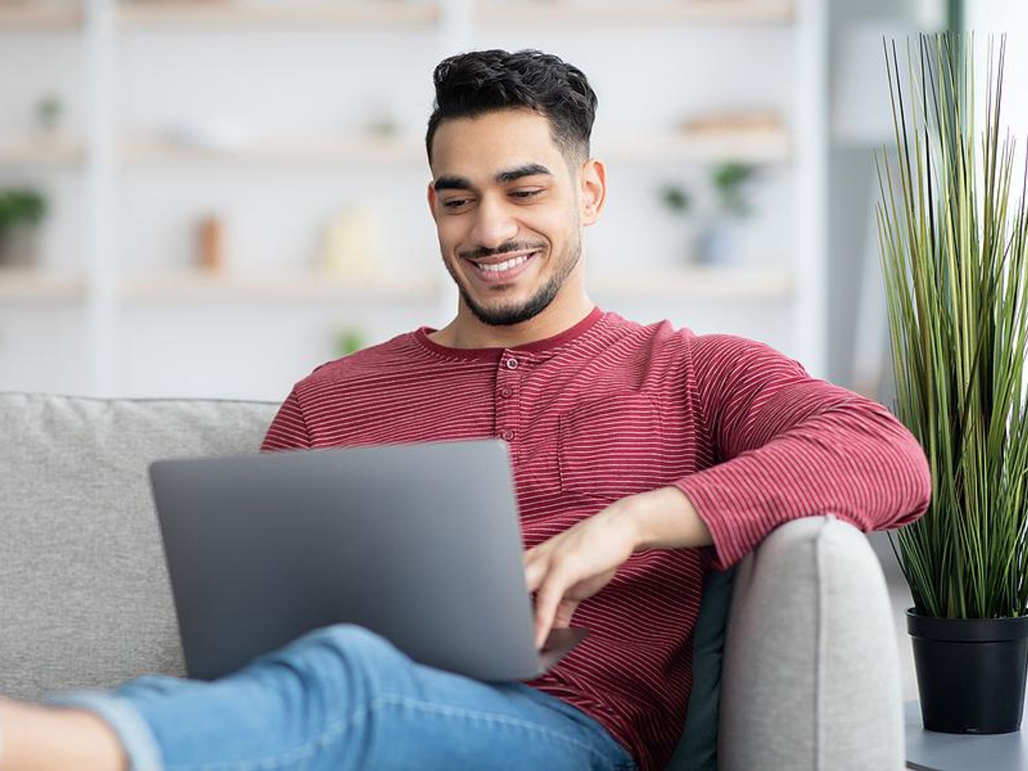 Man on laptop writes an introduction email to someone in his network