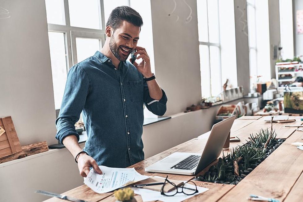 Man on phone actively manages his career