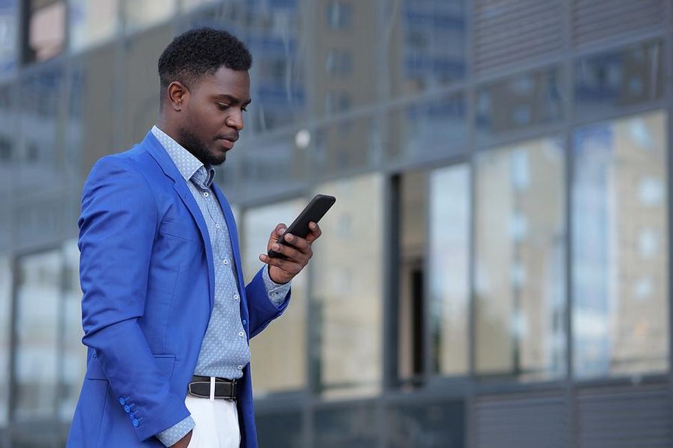 Man on phone builds his professional network