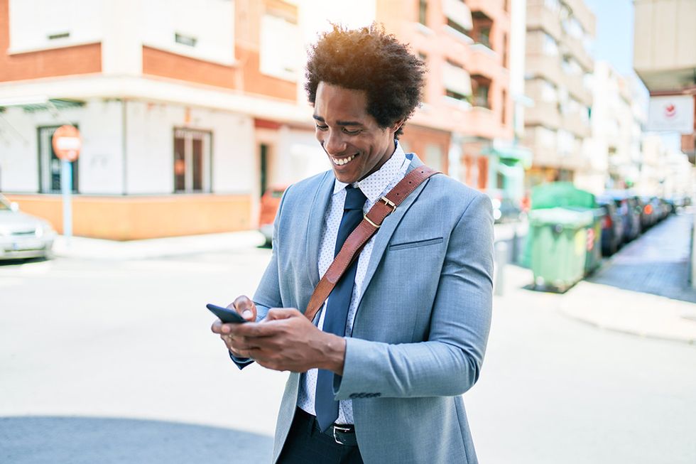 Man on phone follows up with employers during his job search