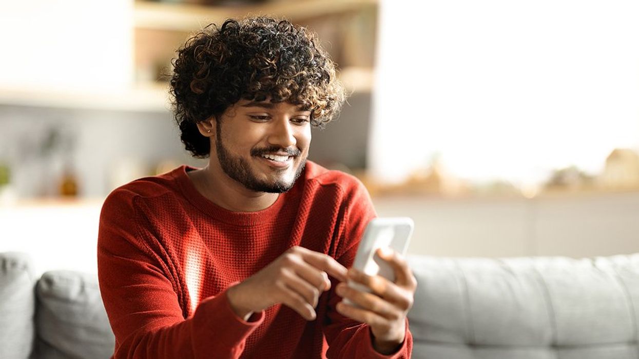 Man on phone networks with people on LinkedIn